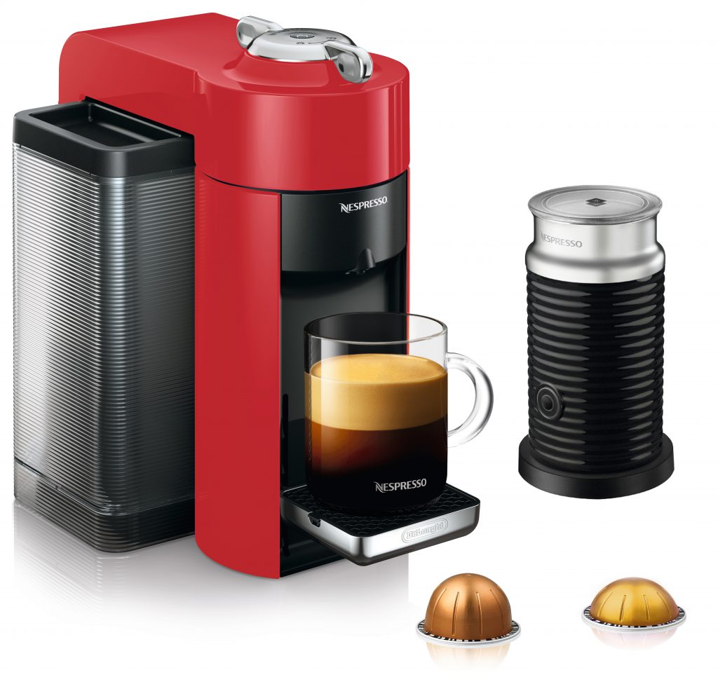 Picture of red Nespresso coffee machine and milk frother. 